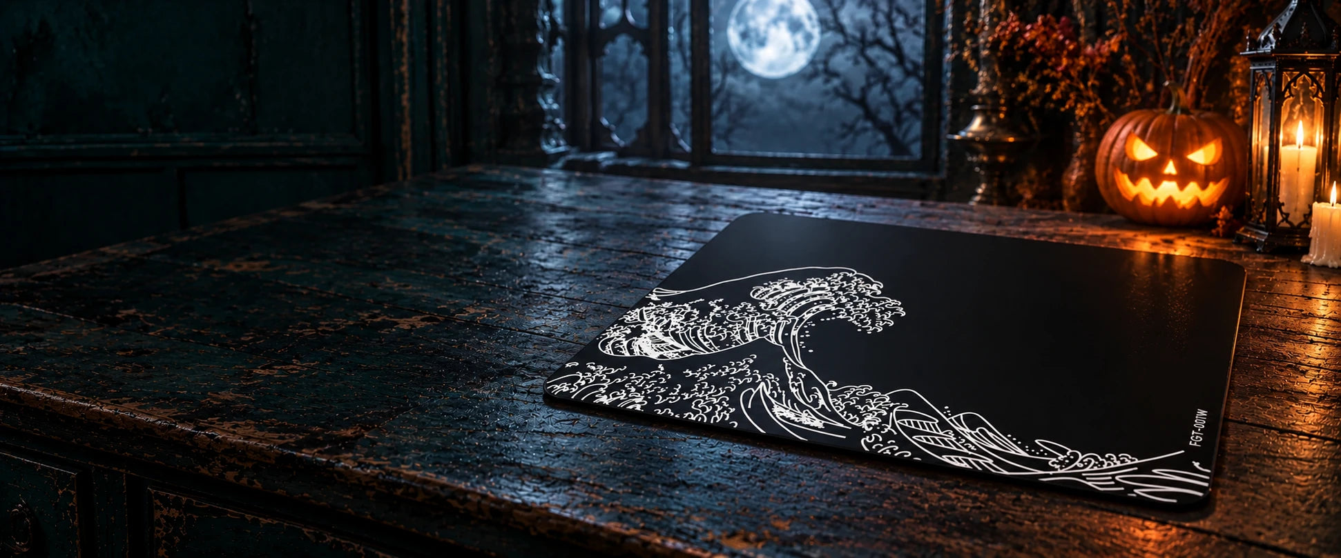 FGT-001W Noir Tsunami glass mousepad on a moonlit desk beside a Halloween pumpkin and lantern